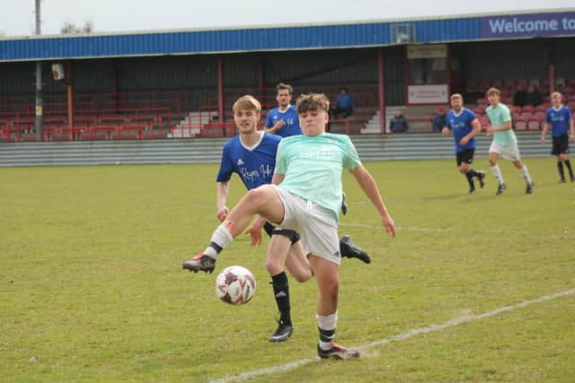 Edgehill teenager George Martin tries to get the ball under control.