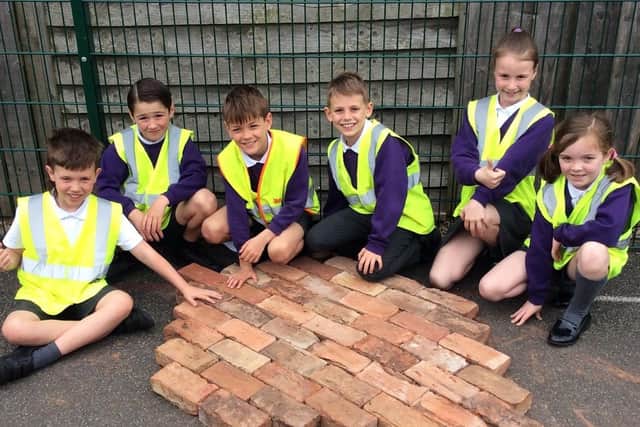 Alne pupils with bricks at York Handmade Brick's factory