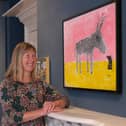 Louise Bass with her painting Donkey Small Bird