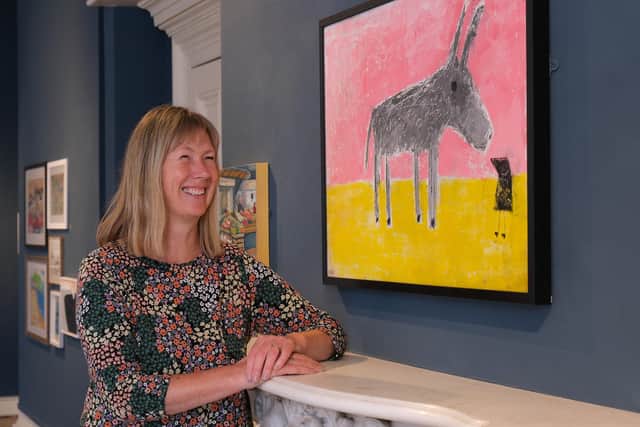 Louise Bass with her painting Donkey Small Bird