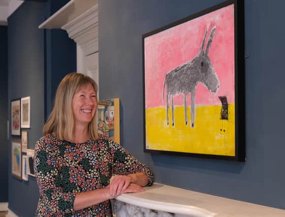 Louise Bass with her painting Donkey Small Bird