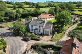An overview of the cottage in its lovely hamlet location.
