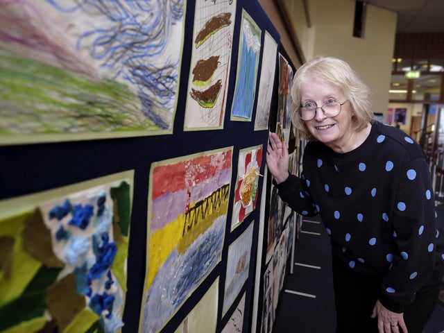 Entries Secretary Sue Rowland enjoys the artwork on display at the Eskdale Festival.
picture: Richard Ponter, 2307170l