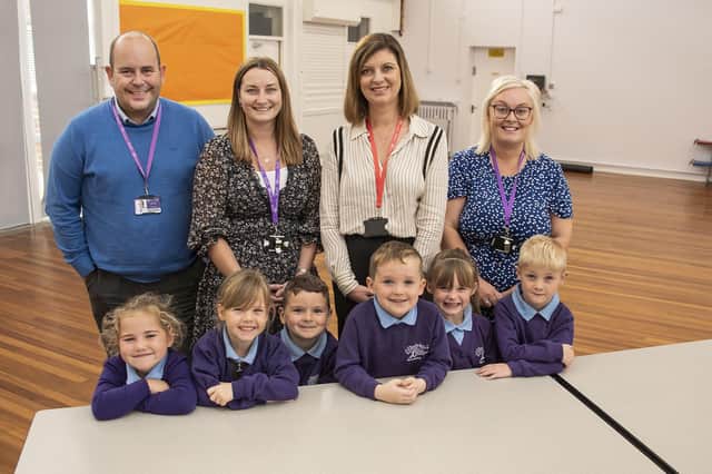 Children from Braeburn Primary and Nursery Academy at one of the new dining hall tables in the refurbished dining hall at the school with, from left, Tim Jolly, headteacher; Helen Clark, assistant headteacher; Amanda Kitto, director of the Cast Iron Bath Company and its sister company Ashbee and Stone; and Amy Hunter, assistant headteacher.