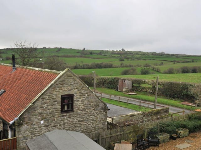 The attractive landscape outside the property that is currently for sale.