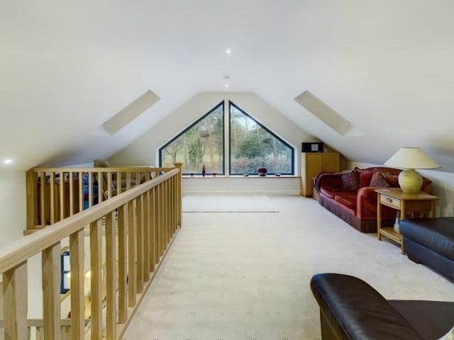 A first floor room with feature window and golf course views.
