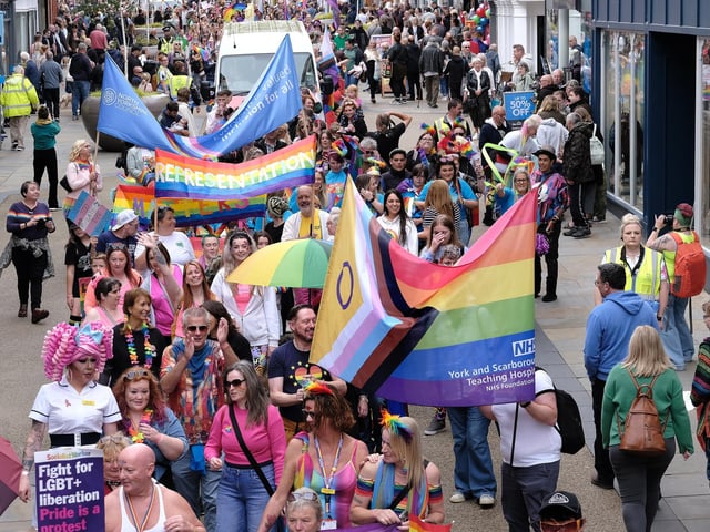The colourful parade makes its way through the town