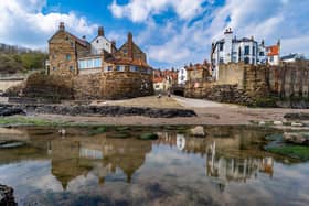 The concrete wall protects the picturesque village of Robin Hood's Bay from coastal erosion.