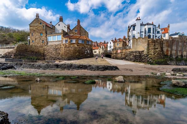 The concrete wall protects the picturesque village of Robin Hood's Bay from coastal erosion.