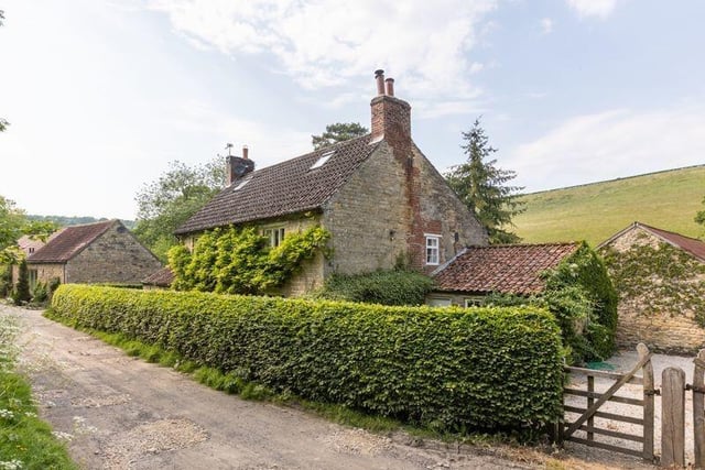 The farmhouse exterior and interior are equally attractive.