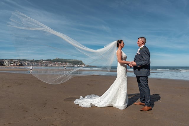 A happy couple celebrate their wedding on the beach at Scarborough.
picture: Clive Welburn Photography