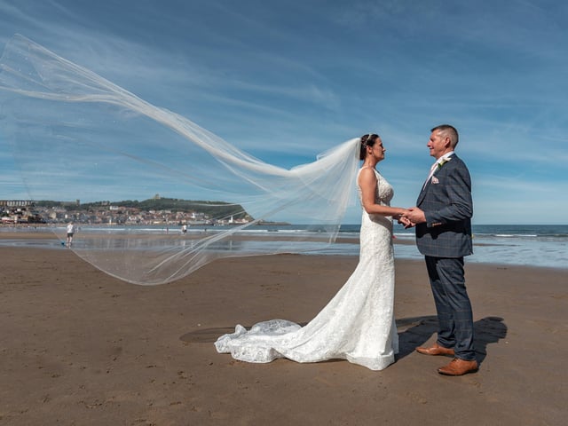 A happy couple celebrate their wedding on the beach at Scarborough.
picture: Clive Welburn Photography