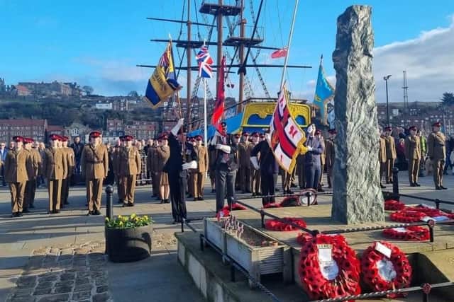 The REME (Corps of Royal Electrical and Mechanical Engineers) at Whitby's war memorial. Photo courtesy of Whitby Town Council.