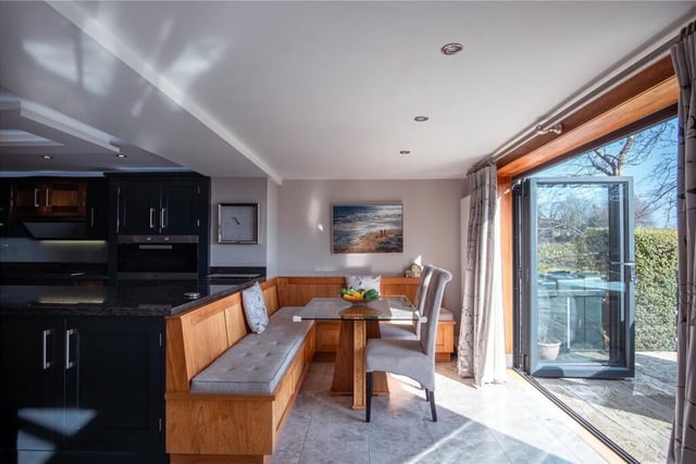Easy indoor to outdoor living, with a decked seating area accessible from the kitchen with diner.