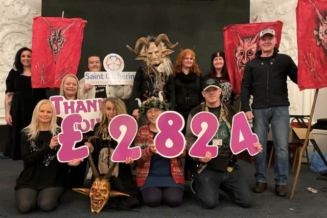 Whitby Krampus Run members with Rachael Bellerby, Finance Director at Saint Catherine’s.