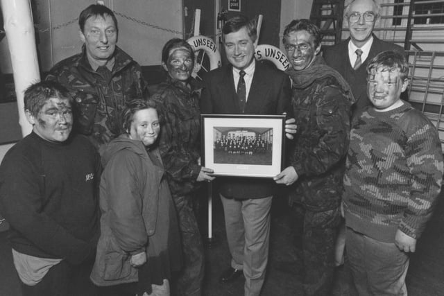 Filey Sea Cadets, fresh from a training exercise, presented local man Chris Ware, centre, with a photo of the unit as thanks for his help back in March 1996. From left, new entry Adam Brammer-Pitt, Lt Cmdr Eddie Temple, new entry Rebecca Duley, A/B Jocelyn Middleton, Chris Ware, L/C Matthew Crosier, Roger Sperry (sea cadets chairman), and Cdt Shaun Artley. 