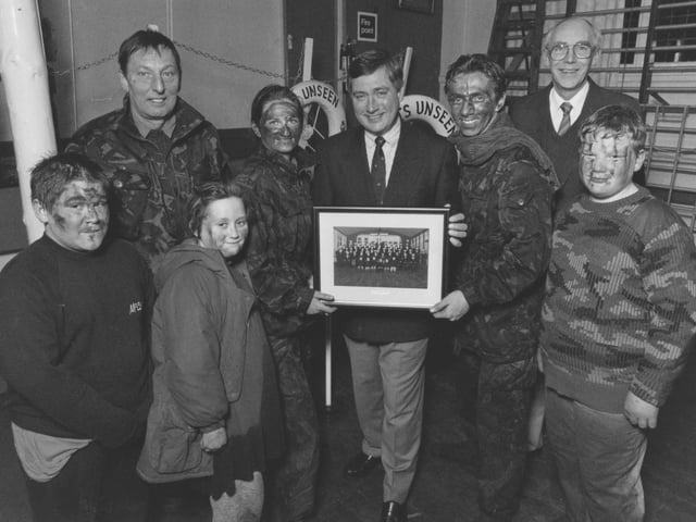 Filey Sea Cadets, fresh from a training exercise, presented local man Chris Ware, centre, with a photo of the unit as thanks for his help back in March 1996. From left, new entry Adam Brammer-Pitt, Lt Cmdr Eddie Temple, new entry Rebecca Duley, A/B Jocelyn Middleton, Chris Ware, L/C Matthew Crosier, Roger Sperry (sea cadets chairman), and Cdt Shaun Artley.