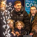 The Christmas lights switch-on in Whitby with Judith Aconley, 5 and Whitby Town skipper Dan Rowe.
picture: Brian Murfield.