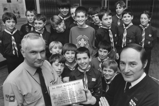 District commissioner John Brett presents retiring Scout Group leader Malcolm Johnson with a plaque recognising his service to the Filey Scout Group in January 1992.