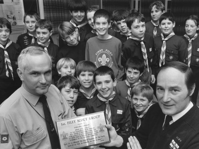 District commissioner John Brett presents retiring Scout Group leader Malcolm Johnson with a plaque recognising his service to the Filey Scout Group in January 1992.