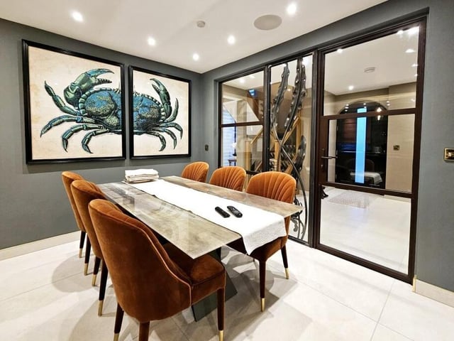 The dining area attracts natural light from the hallway.
