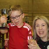 Henry Brown and his Mum Emma enjoying his trophy at the charity sports day in Bridlington to raise money for the youngster.