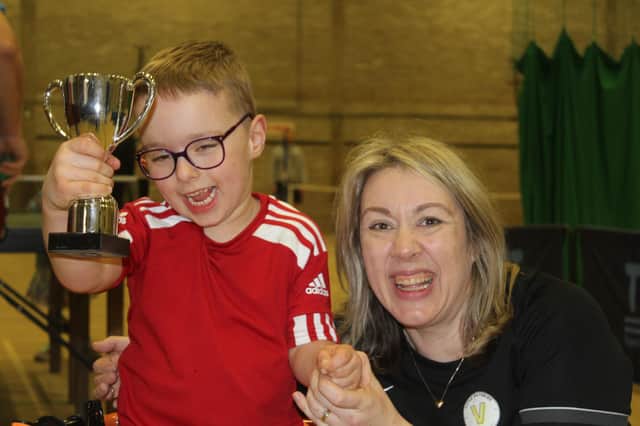Henry Brown and his Mum Emma enjoying his trophy at the charity sports day in Bridlington to raise money for the youngster.