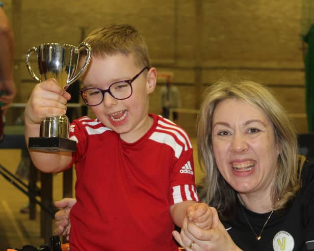 Henry Brown and his Mum Emma enjoying his trophy at the charity sports day in Bridlington to raise money for the youngster.