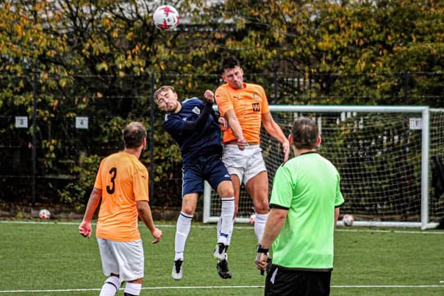 Edgehill's Kieran Link wins a header.