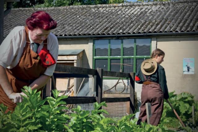 Meet a costumed Land Army girl during Dig for Victory at Eden Camp.