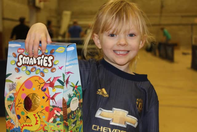 Zsa Zsa Hall shows off her raffle prize.
