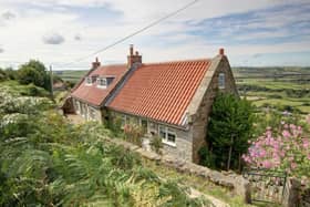 Two cottages as one desirable home, with exceptional views.