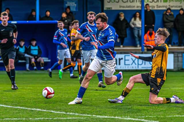 Sam Collins surges upfield. Photo by Brian Murfield