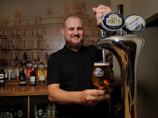 Sam pours a pint