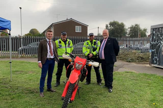 Police and Crime Commissioner Jonathan Evison (right) and Leo Hammond, deputy police and crime commissioner (left) with two police officers and one of the new motorbikes.