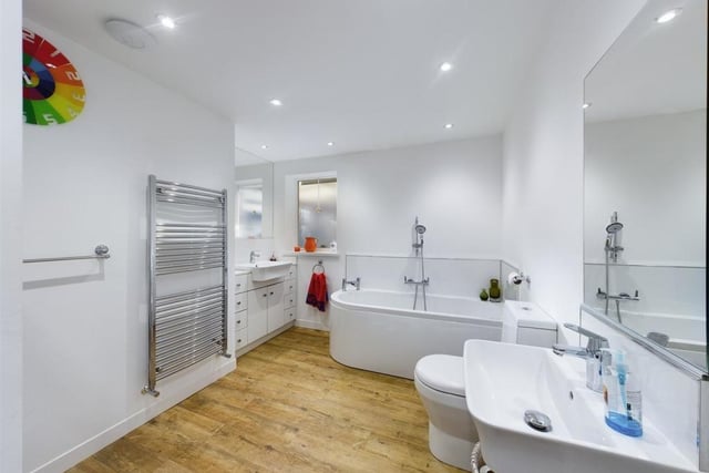 A spacious and modern bathroom within the cottage.