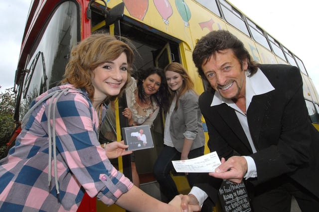 Presenting the winner of an Art Bus competition at the The Ivanhoe pub, Hannah Mitchell, with her prize in 2010.