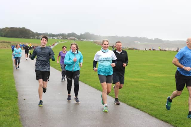 Brid Road Runner Micah Gibson, left, enjoys the parkrun.