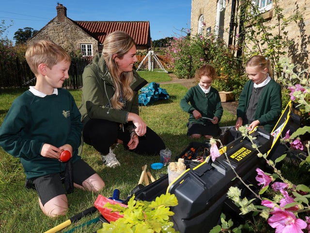Enjoying working outside with teacher Megan Watts