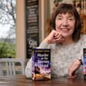 Author Glenda Young with copies of her first two books featuring hotel landlady Helen Dexter