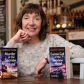 Author Glenda Young with copies of her first two books featuring hotel landlady Helen Dexter