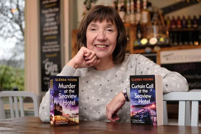 Author Glenda Young with copies of her first two books featuring hotel landlady Helen Dexter