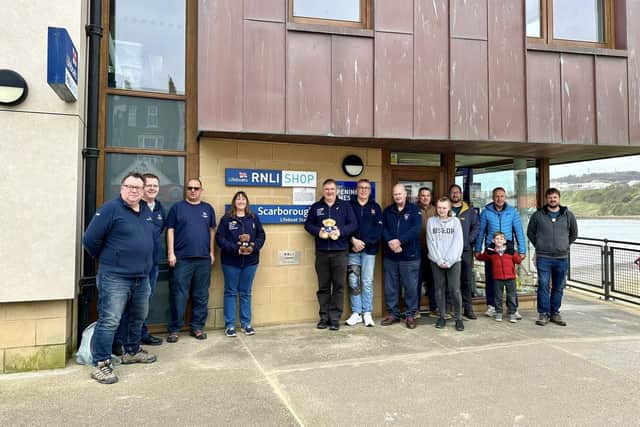 Fundraisers Allan and Helen Thornhill with the hard-working RNLI crew at Scarborough.