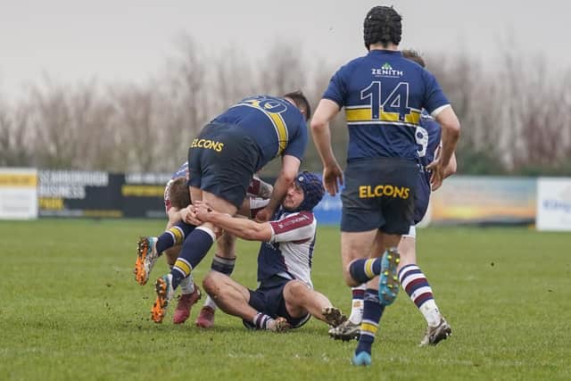 Drew Govier and Nat Parker tackling an Old Crossleyans player during Scarborough RUFC's commanding 54-14 win at Silver Royd on Saturday. Photo by Charlie Hopper
