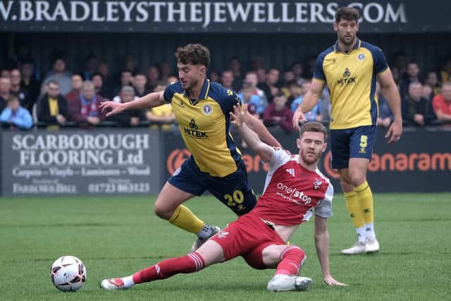 Boro's Kieran Glynn at full stretch to get the ball away from a United player.