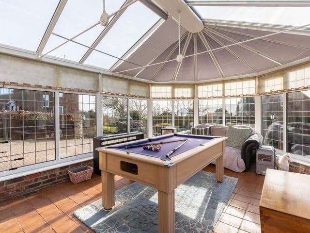 The versatile conservatory is currently in use as a games room.