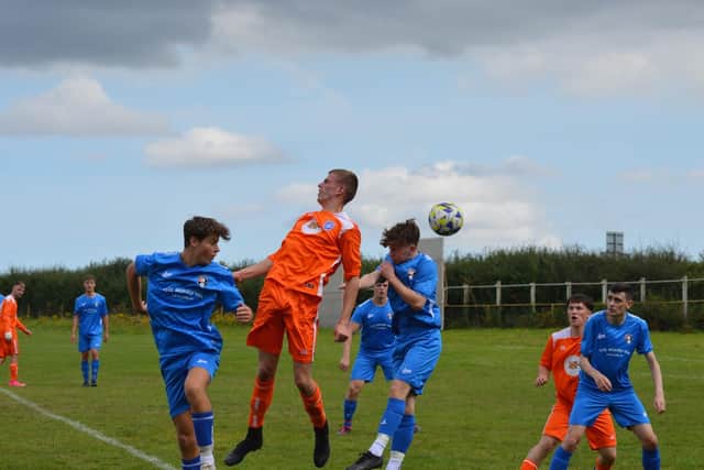 Heslerton, blue kit, claimed a 4-0 win against Fishburn Park Academy.