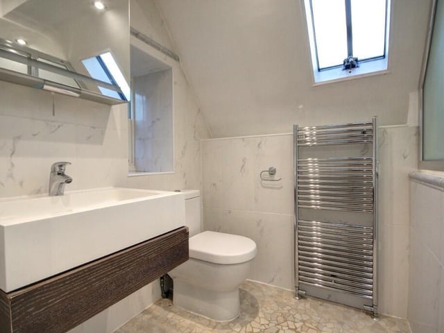 One part of the bathroom with wet room, that has three sections.