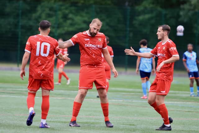 Bridlington Town striker Michael Coulson gets his goalscoring campaign underway in pre-season at Beverley with Jake Day congratulating him. Photo by TCF Photography