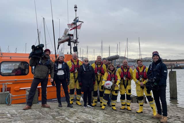 The Songs of Praise filming crew with The Rev Canon Kate Bottley prepare to board Scarborough's Shannon Lifeboat for a special 200th anniversary episode. Image: RNLI/Beth Robson